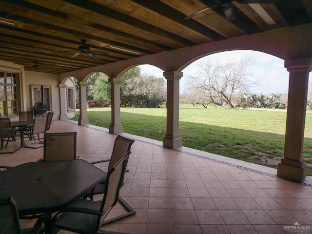 view of patio featuring ceiling fan