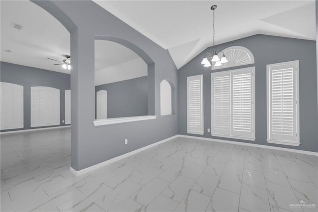 3902 Green Jay Dr, Mission, TX 78572 - unfurnished room with a ceiling fan, marble finish flooring, baseboards, lofted ceiling, and a chandelier