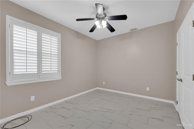 3902 Green Jay Dr, Mission, TX 78572 - spare room featuring marble finish flooring, ceiling fan, and baseboards