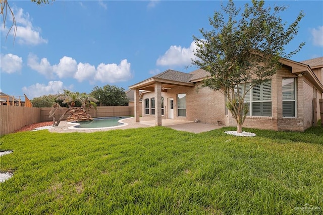 3902 Green Jay Dr, Mission, TX 78572 - rear view of house with brick siding, a patio area, and a ceiling fan