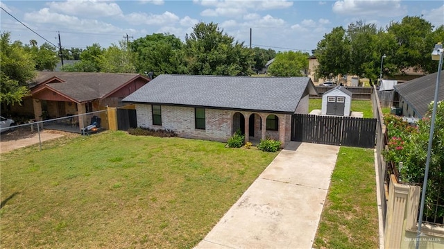 403 N 1st St, Donna, TX 78537 - view of front of property with brick siding, driveway, and a shingled roof