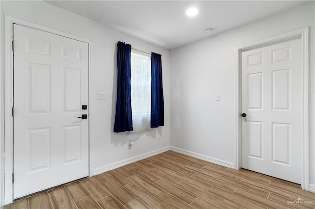 403 N 1st St, Donna, TX 78537 - unfurnished room with baseboards and light wood-style flooring
