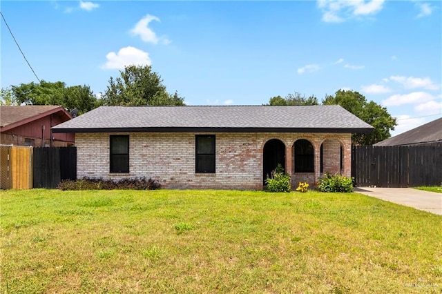 403 N 1st St, Donna, TX 78537 - ranch-style house featuring brick siding and a shingled roof