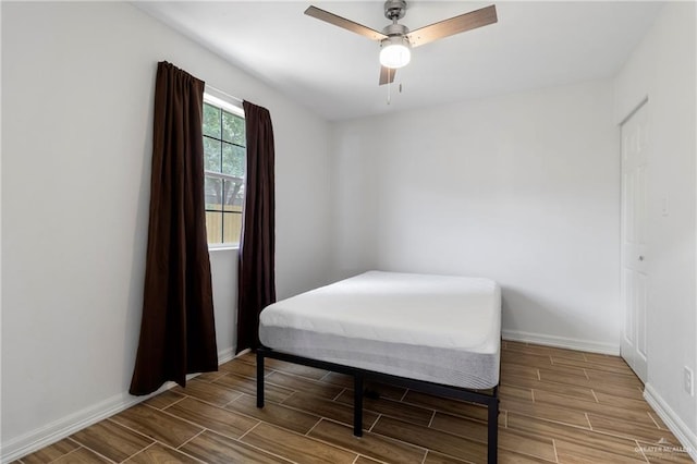 403 N 1st St, Donna, TX 78537 - bedroom featuring wood finish floors, baseboards, and ceiling fan