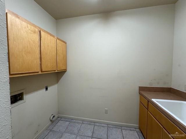 washroom featuring cabinets, electric dryer hookup, and washer hookup