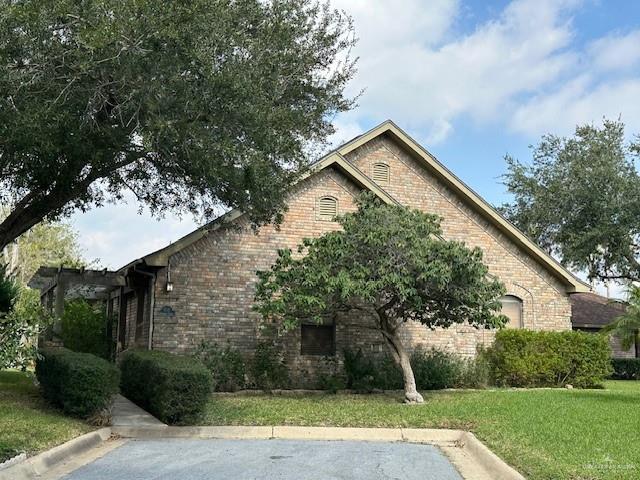 view of home's exterior with a lawn