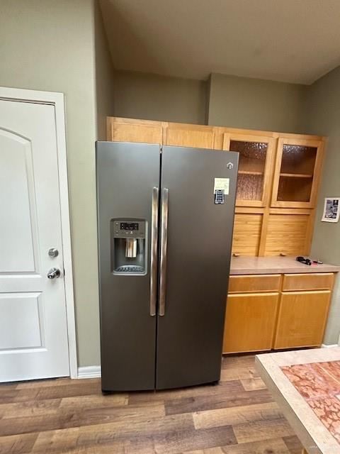 kitchen featuring stainless steel fridge and light wood-type flooring