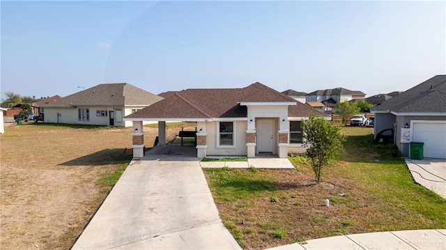 view of front of home with a front yard and a carport