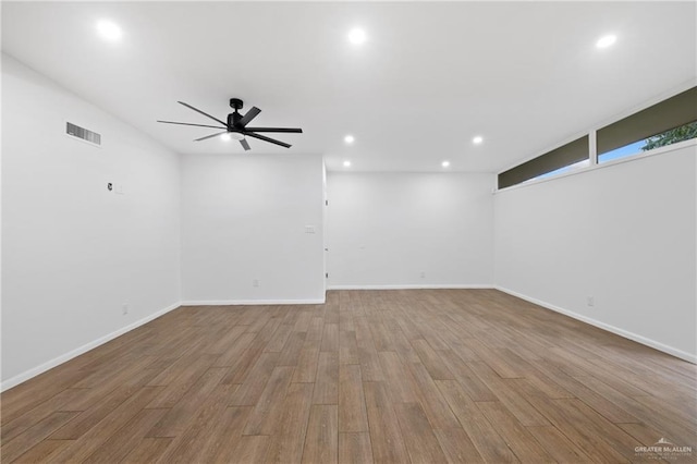 unfurnished room featuring ceiling fan and light hardwood / wood-style flooring