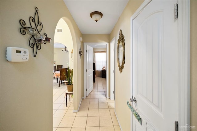 hallway featuring light tile patterned flooring