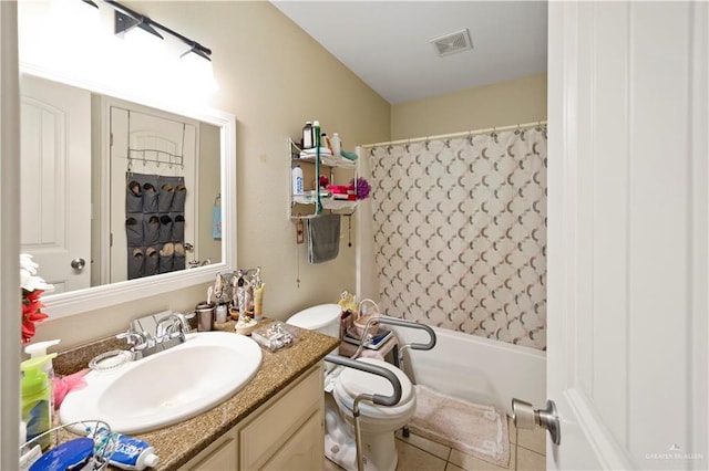 full bathroom featuring tile patterned floors, vanity, shower / bath combination with curtain, and toilet