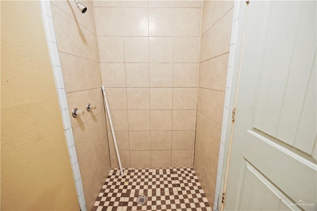 bathroom with tiled shower