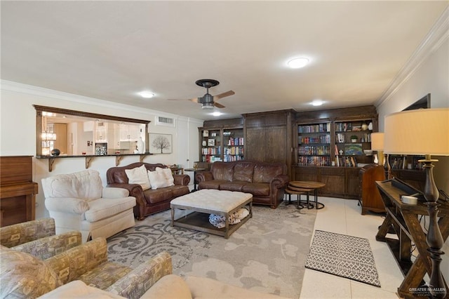 living room featuring crown molding, ceiling fan, and light tile patterned flooring