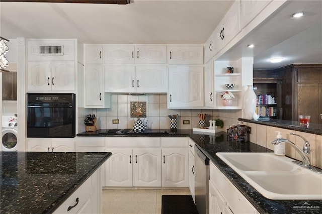 kitchen with sink, tasteful backsplash, black appliances, washer / clothes dryer, and white cabinets