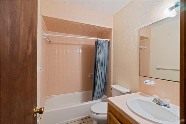 full bathroom featuring shower / tub combo with curtain, vanity, toilet, and tile patterned flooring