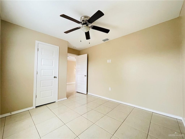 1411 Oak St, Weslaco, TX 78596 - unfurnished room featuring light tile patterned floors, baseboards, visible vents, and ceiling fan