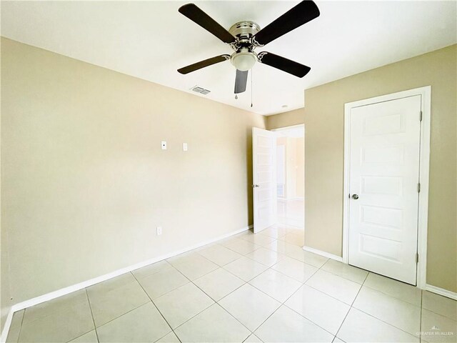 1411 Oak St, Weslaco, TX 78596 - spare room with ceiling fan, baseboards, visible vents, and light tile patterned floors