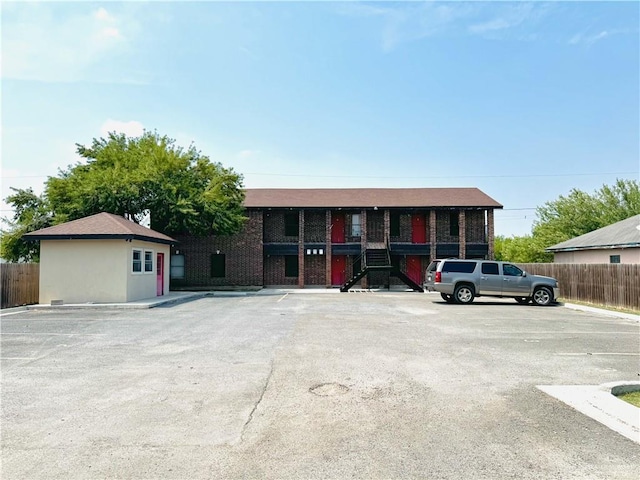 1411 Oak St, Weslaco, TX 78596 - view of front of home with uncovered parking and fence