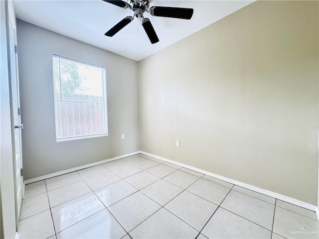 1411 Oak St, Weslaco, TX 78596 - empty room with a ceiling fan, baseboards, and light tile patterned floors