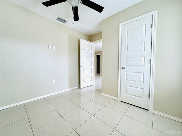 1411 Oak St, Weslaco, TX 78596 - empty room with light tile patterned flooring, visible vents, and a ceiling fan