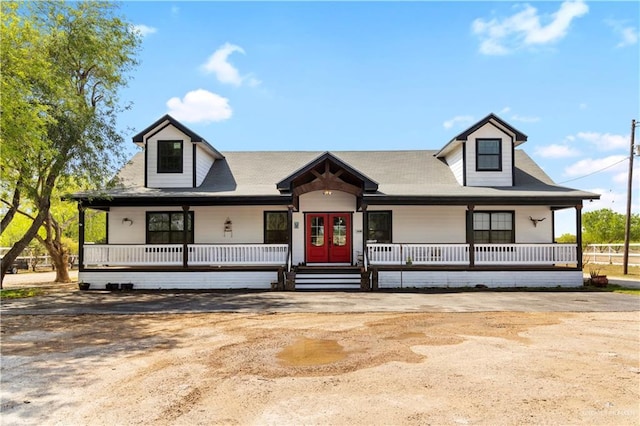 view of front of property featuring french doors and a porch