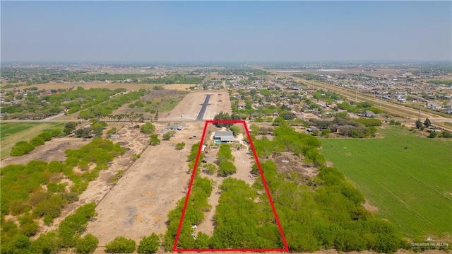 birds eye view of property featuring a rural view