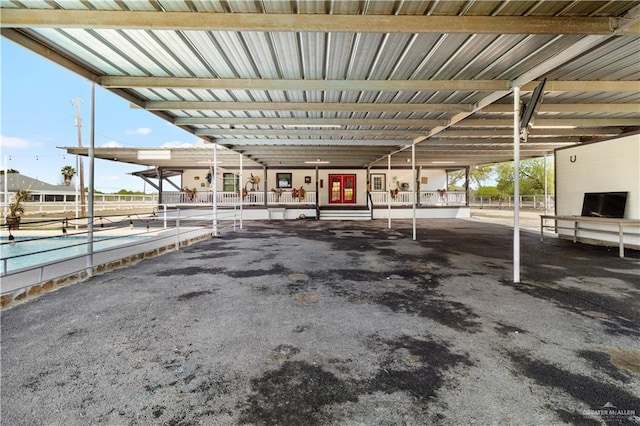 view of parking with an attached carport