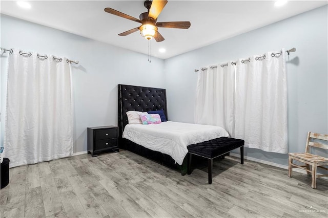 bedroom featuring recessed lighting, ceiling fan, baseboards, and wood finished floors