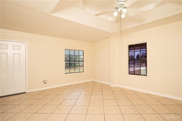 unfurnished room with a raised ceiling and ceiling fan