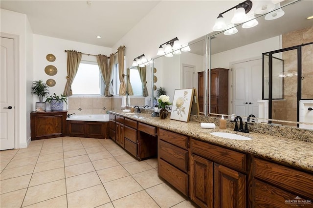 806 Beryl Cir, Weslaco, TX 78596 - bathroom with tile patterned floors, a stall shower, double vanity, and a bath