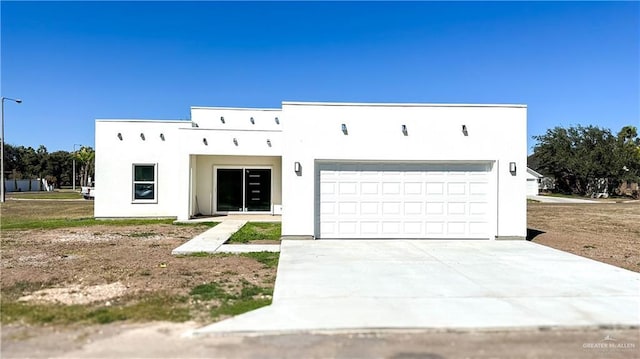 1509 Vida Dulce, Weslaco, TX 78596 - view of front of house with stucco siding and concrete driveway