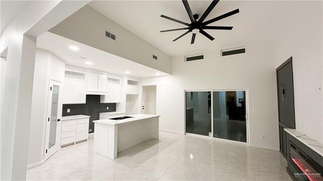 1509 Vida Dulce, Weslaco, TX 78596 - kitchen featuring a center island, white cabinetry, cooktop, a ceiling fan, and recessed lighting