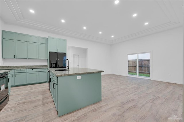 4720 Waterford Ave, Edinburg, TX 78539 - kitchen featuring refrigerator with ice dispenser, a sink, crown molding, a tray ceiling, and light wood-style floors