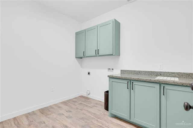 4720 Waterford Ave, Edinburg, TX 78539 - washroom with electric dryer hookup, cabinet space, light wood-style flooring, hookup for a washing machine, and baseboards