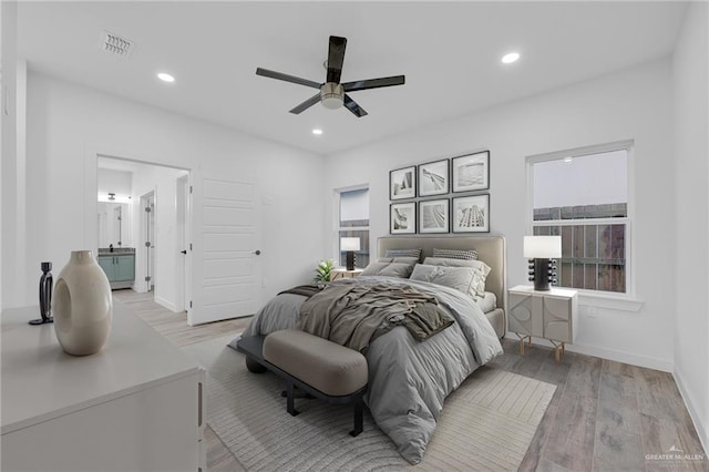 4720 Waterford Ave, Edinburg, TX 78539 - bedroom featuring light wood finished floors, recessed lighting, baseboards, connected bathroom, and ceiling fan