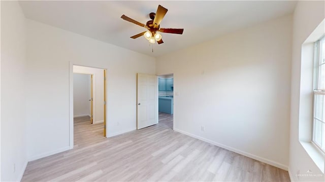 unfurnished bedroom with ceiling fan and light wood-type flooring