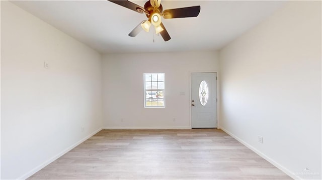 foyer entrance with light wood-type flooring and ceiling fan