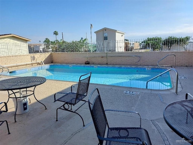 view of pool featuring a patio area