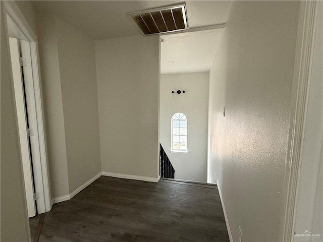 corridor with dark wood-type flooring