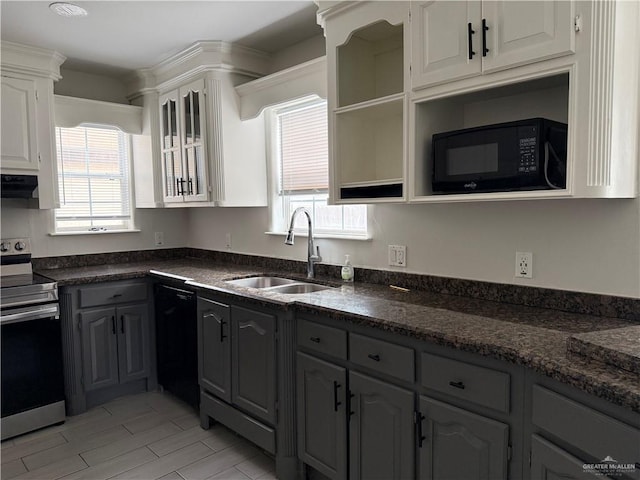 kitchen featuring gray cabinetry, sink, plenty of natural light, white cabinets, and black appliances