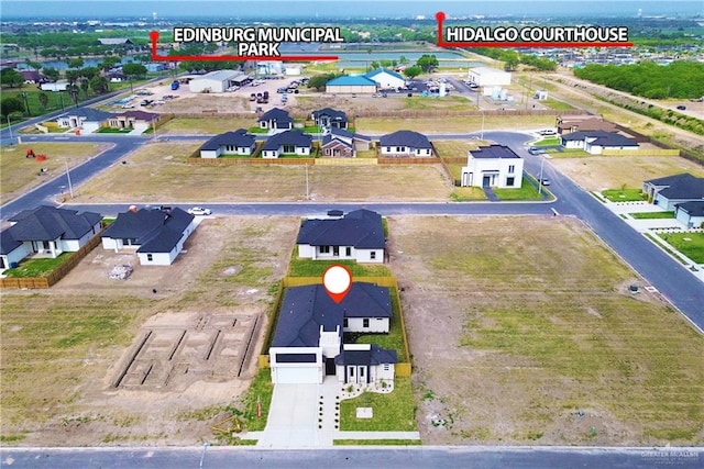 birds eye view of property with a residential view