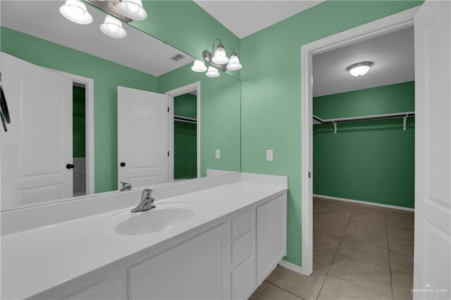 bathroom featuring tile patterned floors and vanity