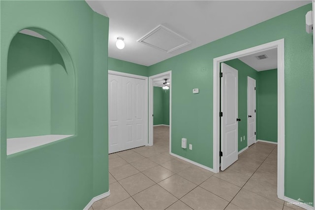 interior space with ceiling fan