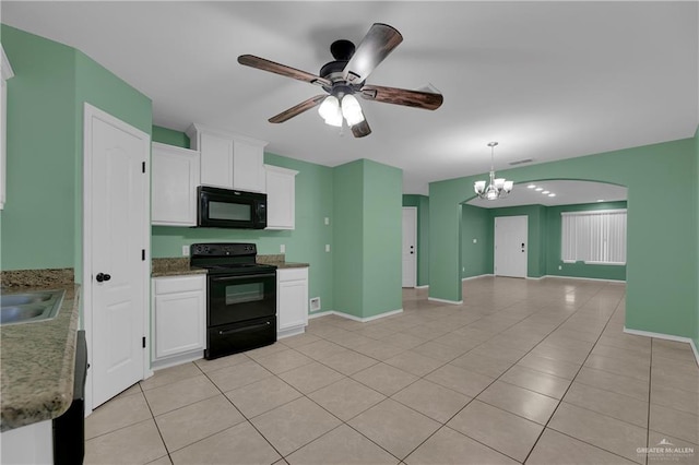 kitchen with light tile patterned floors, ceiling fan with notable chandelier, white cabinetry, and black appliances