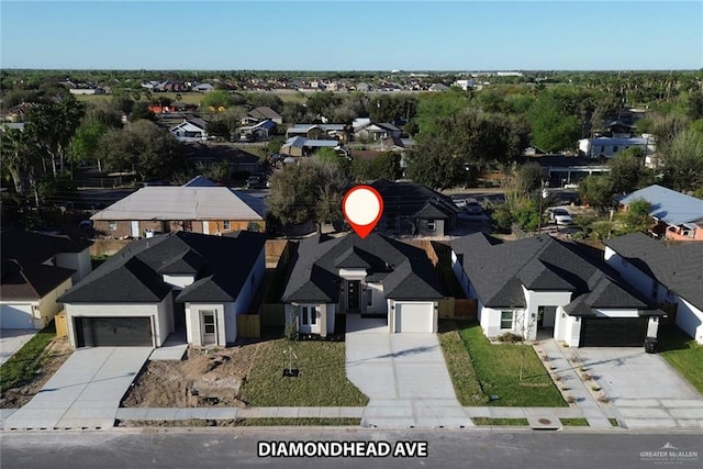 birds eye view of property with a residential view