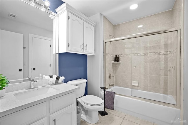 317 Ohara Dr, Pharr, TX 78577 - full bathroom with tile patterned floors, bath / shower combo with glass door, toilet, and vanity