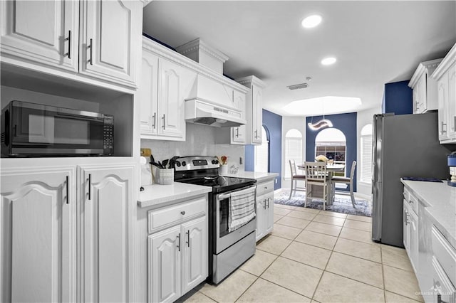 317 Ohara Dr, Pharr, TX 78577 - kitchen featuring appliances with stainless steel finishes, light countertops, white cabinets, light tile patterned floors, and recessed lighting