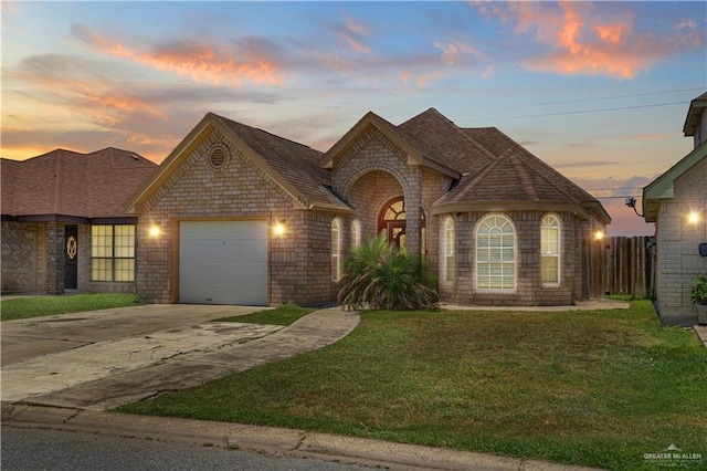 317 Ohara Dr, Pharr, TX 78577 - french country style house with a garage, concrete driveway, and roof with shingles