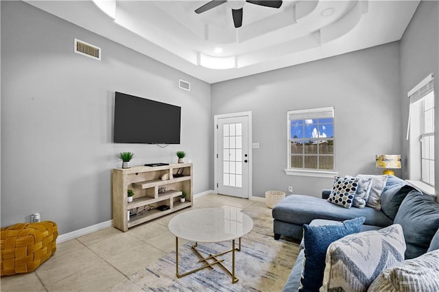 317 Ohara Dr, Pharr, TX 78577 - living area featuring a ceiling fan, light tile patterned floors, a raised ceiling, and baseboards