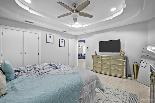 317 Ohara Dr, Pharr, TX 78577 - bedroom with a raised ceiling, light tile patterned flooring, a ceiling fan, arched walkways, and recessed lighting